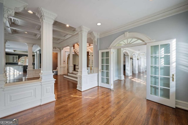 interior space featuring french doors, recessed lighting, ornamental molding, wood finished floors, and ornate columns