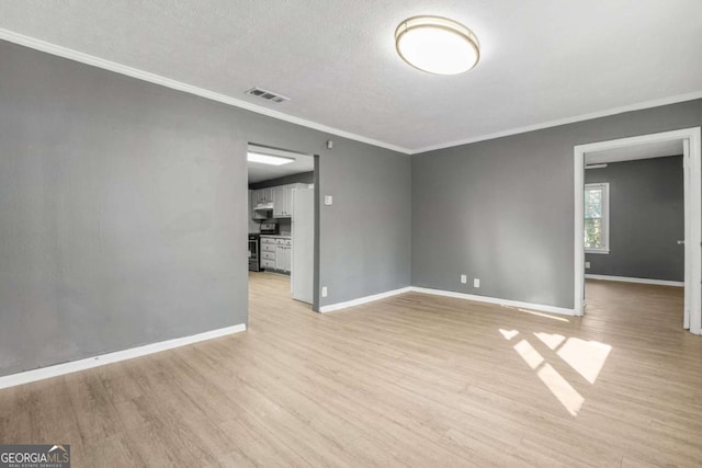 391 Mount Zion Rd SW, Atlanta, GA 30354 - unfurnished room with light wood-type flooring, baseboards, visible vents, and crown molding