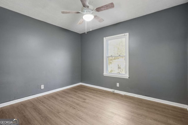 391 Mount Zion Rd SW, Atlanta, GA 30354 - empty room with ceiling fan, baseboards, and wood finished floors