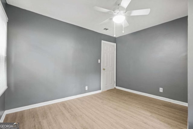 391 Mount Zion Rd SW, Atlanta, GA 30354 - unfurnished room with visible vents, a ceiling fan, light wood-style flooring, and baseboards