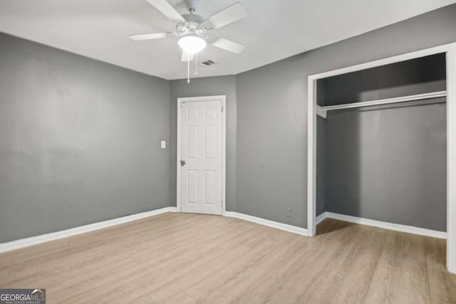 391 Mount Zion Rd SW, Atlanta, GA 30354 - unfurnished bedroom with light wood finished floors, baseboards, visible vents, ceiling fan, and a closet