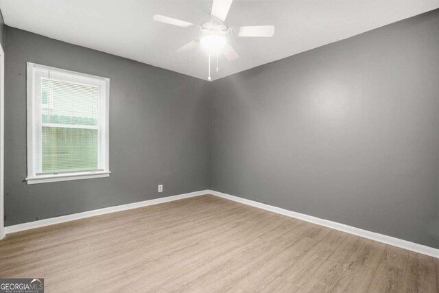 391 Mount Zion Rd SW, Atlanta, GA 30354 - spare room featuring a ceiling fan, light wood-style flooring, and baseboards
