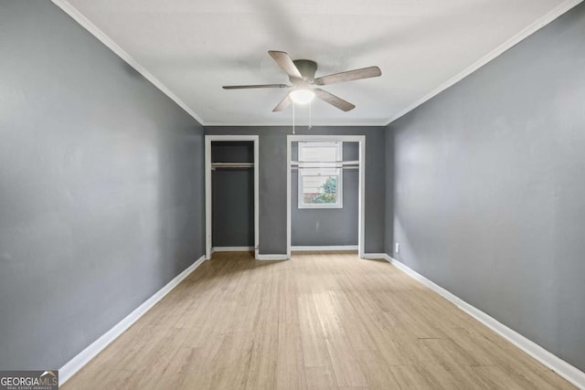 391 Mount Zion Rd SW, Atlanta, GA 30354 - unfurnished bedroom with light wood-style floors, a ceiling fan, baseboards, and crown molding