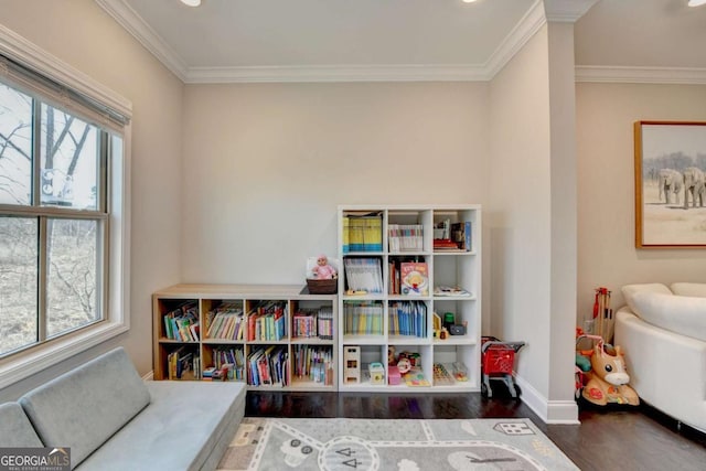 rec room featuring dark wood-type flooring, recessed lighting, ornamental molding, and baseboards