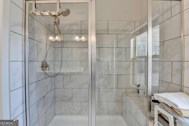 bathroom with a shower stall