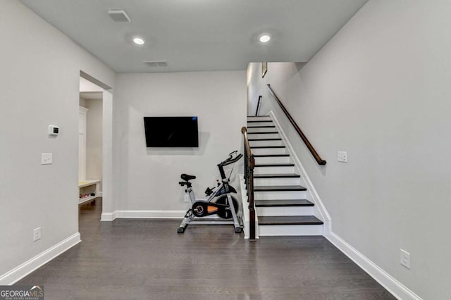 workout area with recessed lighting, dark wood-style flooring, visible vents, and baseboards