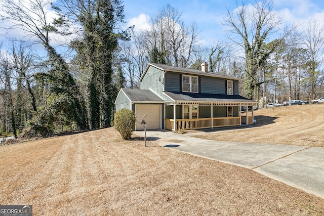 view of front of property featuring a garage, covered porch, a chimney, and concrete driveway