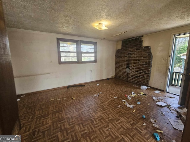 unfurnished living room featuring a textured ceiling