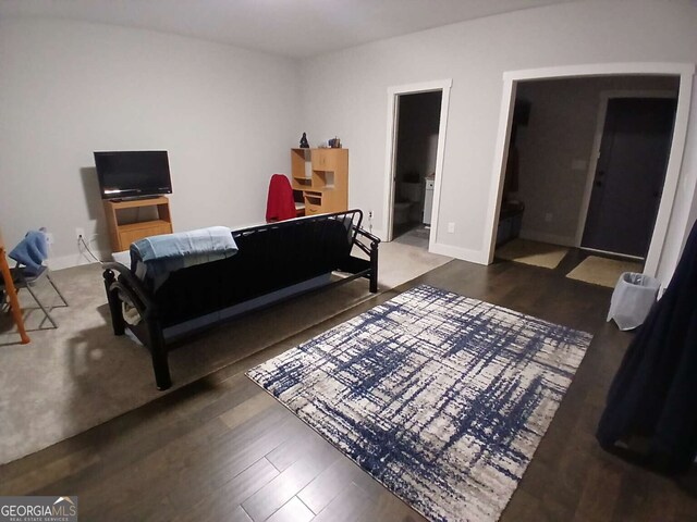 interior details featuring a fireplace, wood finished floors, and baseboards