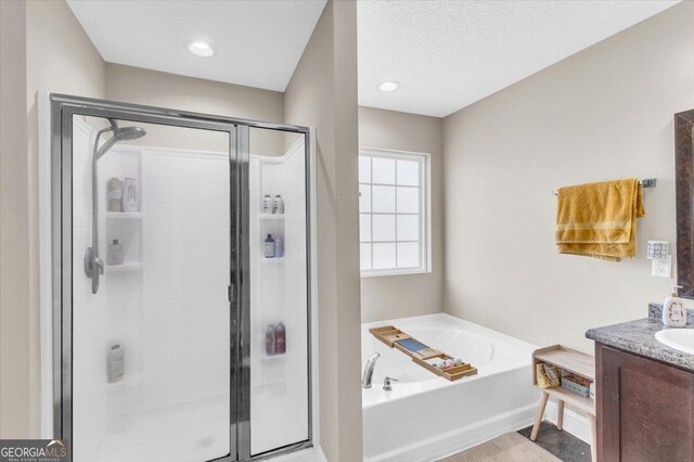 732 Waterlily Ct, Hinesville, GA 31313 - bathroom with vanity, a shower stall, and a bath