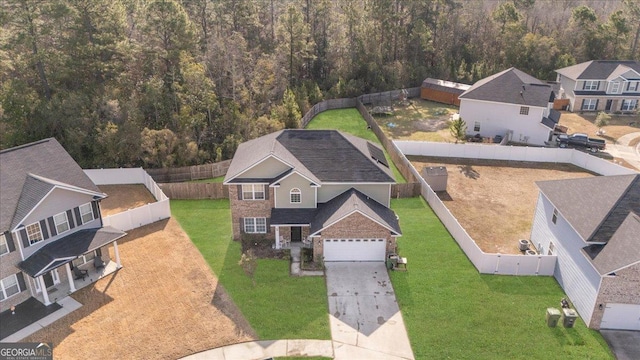 birds eye view of property with a residential view