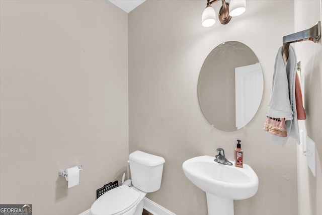 732 Waterlily Ct, Hinesville, GA 31313 - half bath with baseboards, toilet, and a sink