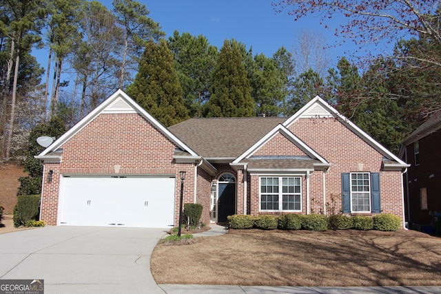 ranch-style home featuring a garage, driveway, a shingled roof, and brick siding