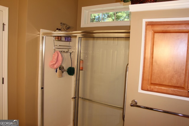 bathroom featuring a shower stall