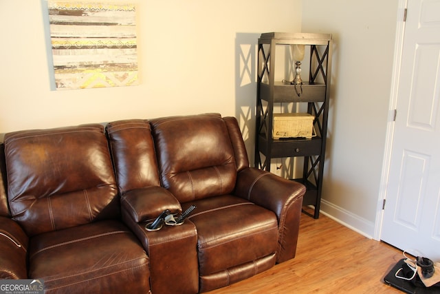 living area featuring wood finished floors and baseboards