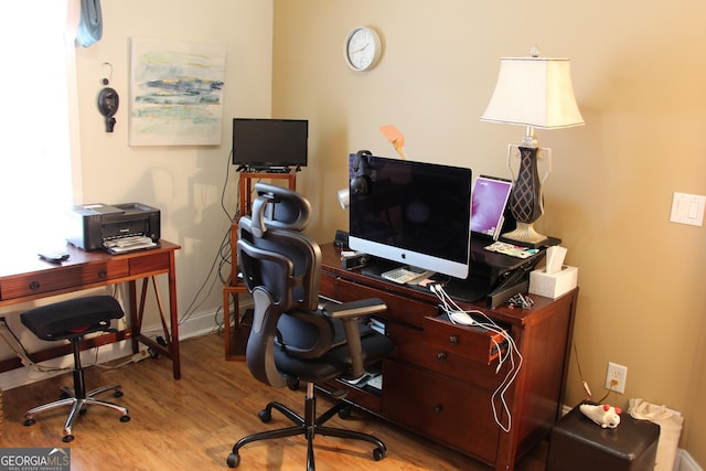 office area featuring wood finished floors and baseboards