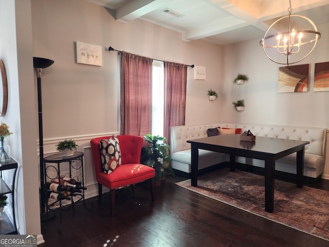 sitting room with a notable chandelier, visible vents, wainscoting, beamed ceiling, and dark wood finished floors