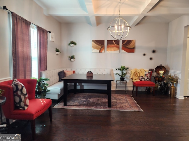 sitting room featuring dark wood-style flooring, coffered ceiling, beam ceiling, and an inviting chandelier