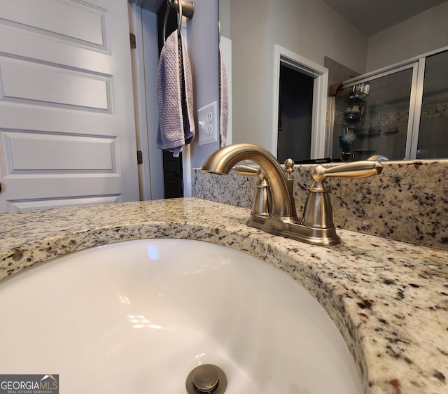 interior details featuring a shower stall and vanity