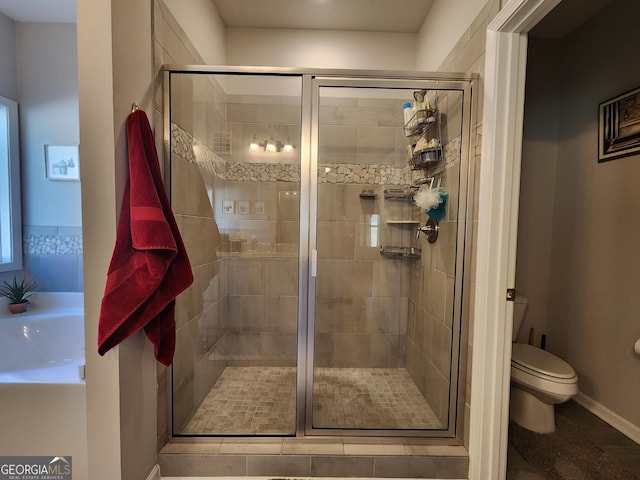 full bath with a shower stall and toilet