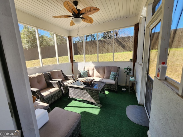 sunroom / solarium with ceiling fan and wood ceiling