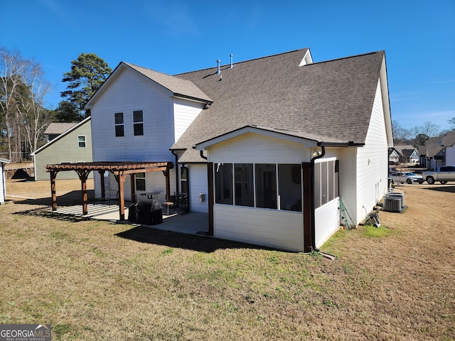 back of property featuring a sunroom, roof with shingles, a yard, a patio area, and a pergola