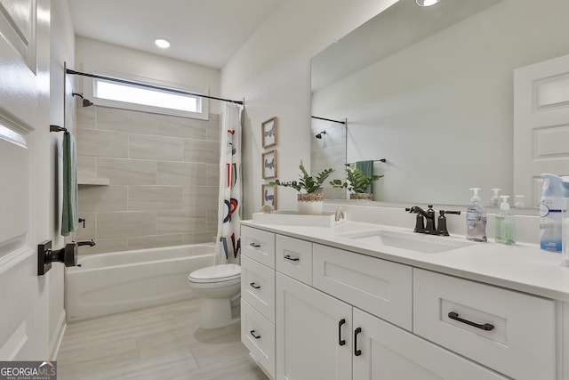 full bath featuring shower / tub combo, vanity, and toilet