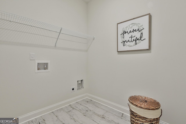 laundry room with laundry area, washer hookup, electric dryer hookup, and baseboards