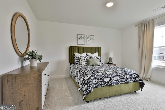 bedroom featuring carpet, visible vents, and baseboards