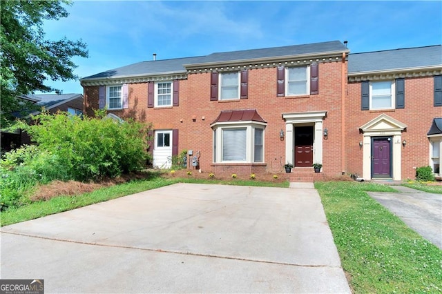 view of front of house with brick siding