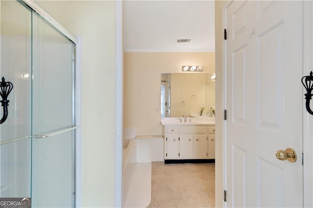 bathroom featuring visible vents, ornamental molding, a shower with shower door, a garden tub, and vanity