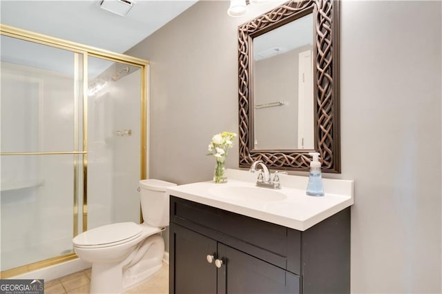 full bathroom with visible vents, toilet, tile patterned flooring, vanity, and a shower stall