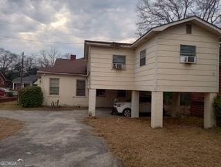 exterior space featuring driveway and a carport