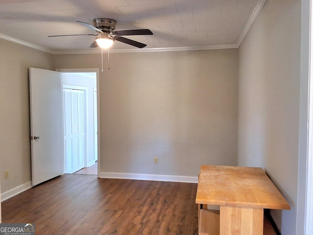 unfurnished room with baseboards, dark wood-type flooring, a ceiling fan, and crown molding