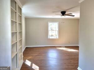 1014 Walnut St, Louisville, GA 30434 - spare room with ceiling fan and wood finished floors