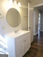 bathroom featuring vanity and wood finished floors