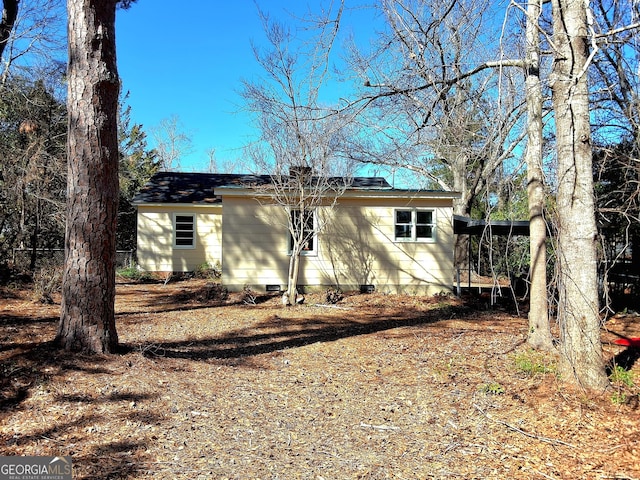 view of front of home featuring crawl space