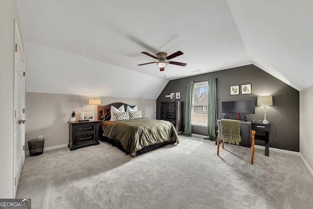 bedroom with visible vents, baseboards, light colored carpet, lofted ceiling, and ceiling fan