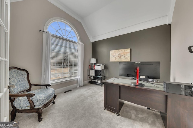 office area featuring visible vents, ornamental molding, light carpet, vaulted ceiling, and baseboards