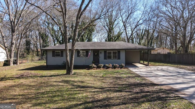 ranch-style home featuring driveway, a front lawn, and fence