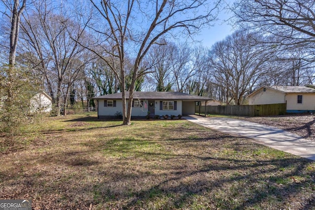 single story home featuring driveway, a front lawn, and fence