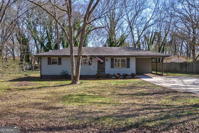 ranch-style home with driveway, a front lawn, and fence