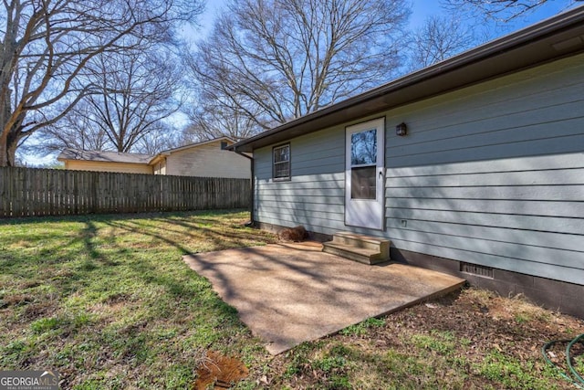 view of yard featuring entry steps, a patio area, and fence