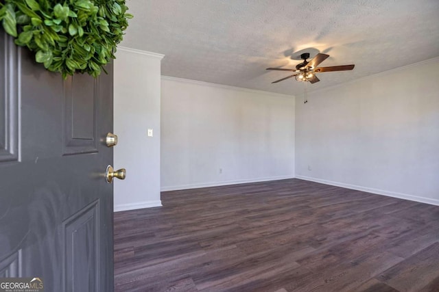 interior space with dark wood-style flooring, ornamental molding, a ceiling fan, a textured ceiling, and baseboards