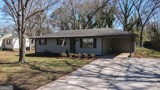 ranch-style house with driveway and a front lawn