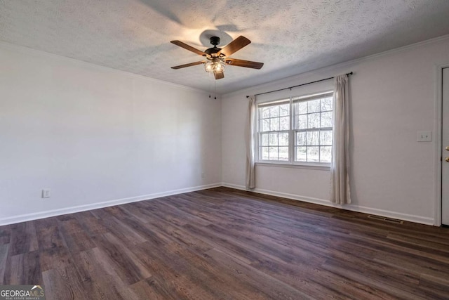 empty room featuring dark wood-style floors, visible vents, a textured ceiling, and baseboards