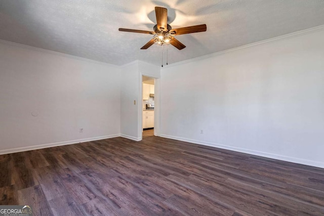 unfurnished room with dark wood-style floors, crown molding, and a textured ceiling