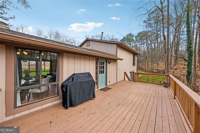 wooden terrace with area for grilling