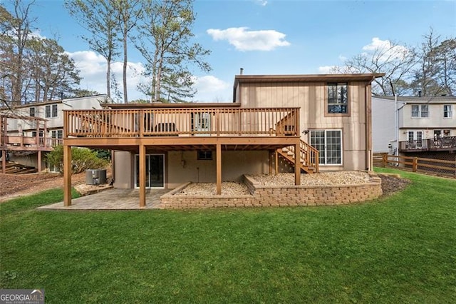 back of house featuring a patio area, a lawn, stairway, and a wooden deck