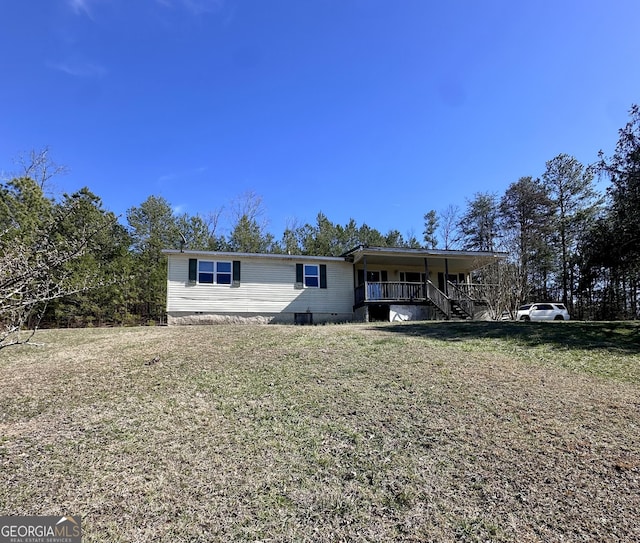 view of front of property with crawl space, covered porch, and a front yard